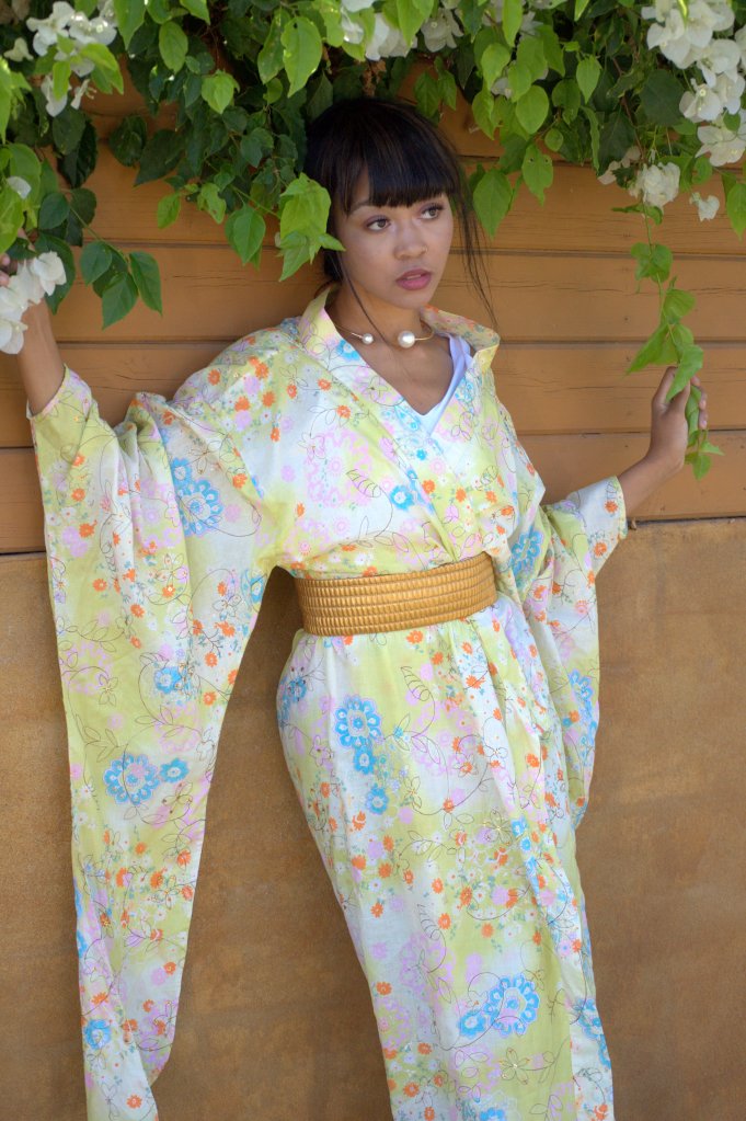 Japanese inspired kimono displaying vibrant pastels and fun flower designs. 